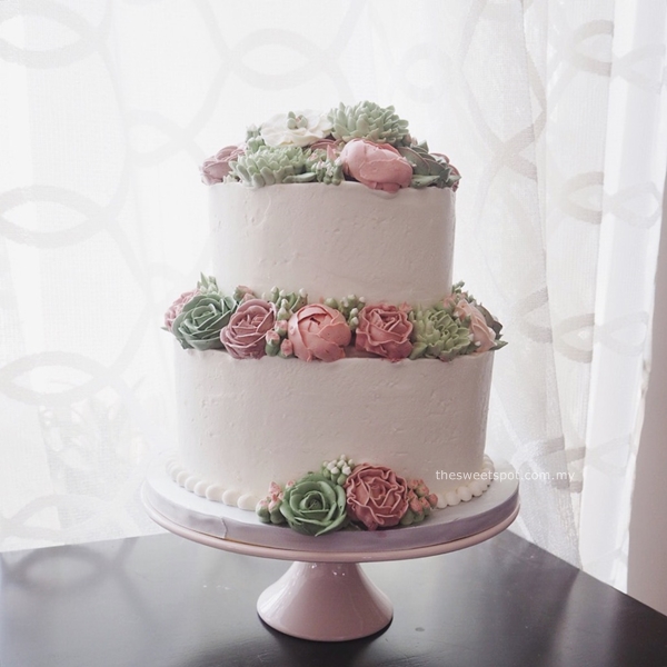 2 tier buttercream flower wedding cake