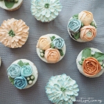 blue and orange buttercream flower cupcakes