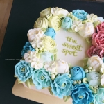 square cake with open peonies