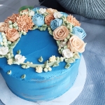 Sahara Blue cake with beige and blue flowers